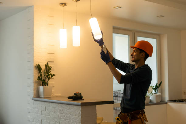 electrician-installs-lamp-lighti.png